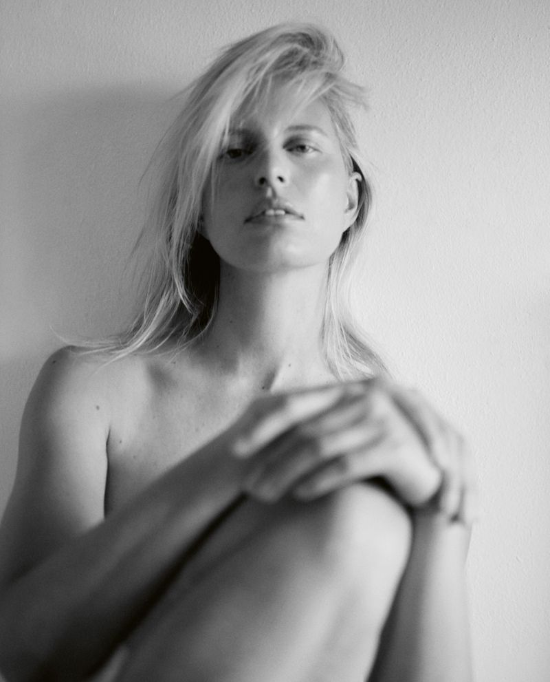 Portrait of Karolina Kurkova with blonde hair against a plain white background for Vogue Czechoslovakia