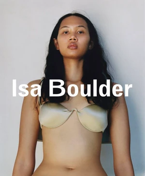 Model wearing a metallic satin bra top against a white seamless background with overlaid text