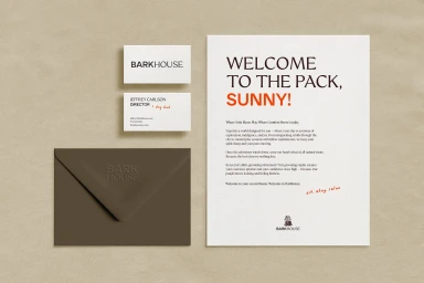 Barkhouse brand identity stationery layout including business cards, a welcome letter, and a dark envelope on textured paper.