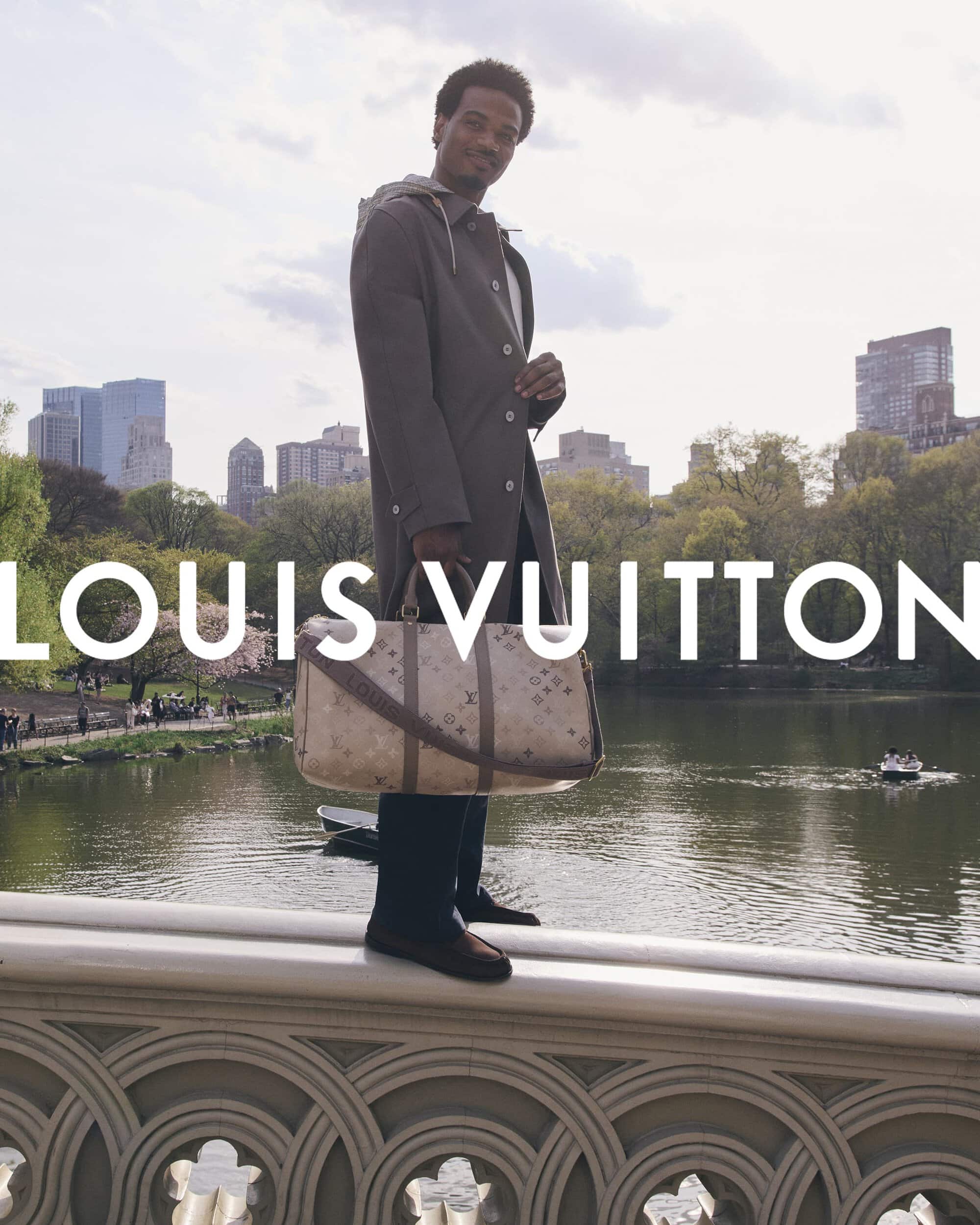 Tyshawn Jones standing on a stone bridge holding a monogram duffel bag for the Louis Vuitton Pre-Fall 2026 Men's Campaign.