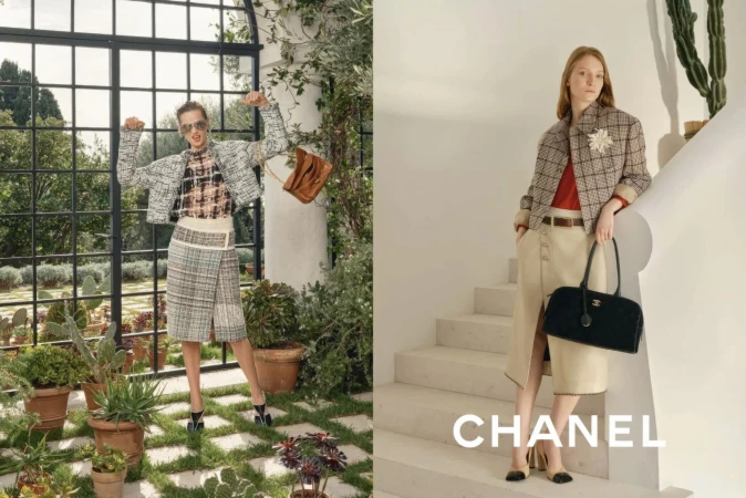 Two women modeling tweed skirt suits and carrying handbags outdoors. One woman poses near a window, the other on a staircase.