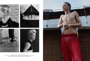 Editorial layout featuring a shirtless male model wearing red sheer trousers and a dark swim cap leaning against wooden cabinets.