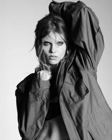 Model Ida Heiner posing in a dark utility jacket for Double Vision, captured in black and white by Luigi and Iango.