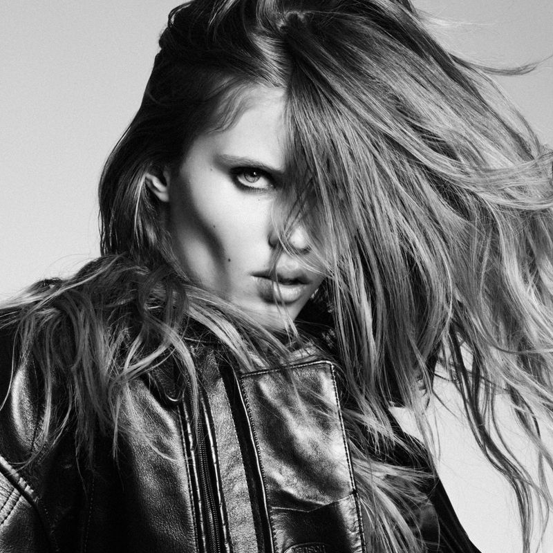 Model Ida Heiner with flowing hair wearing a black leather jacket in a portrait by Luigi & Iango for Double Vision.