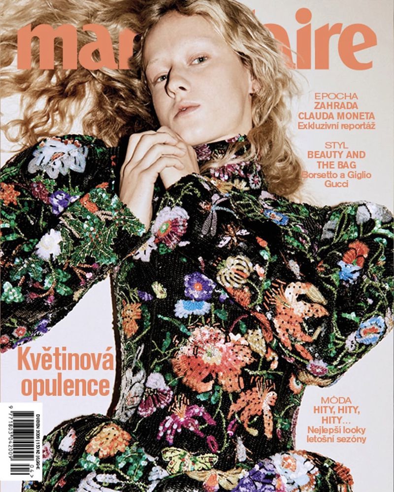Marie Claire cover featuring a woman with blonde hair, wearing a black dress with colorful floral embellishments and an up close portrait.