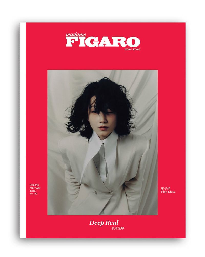 Madame Figaro Hong Kong magazine cover featuring a person with dark hair wearing a white suit against a draped backdrop.
