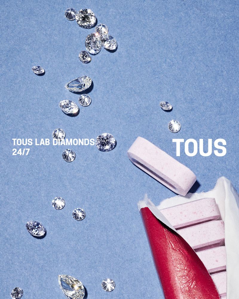 Overhead studio shot of TOUS lab-created diamonds with a pink lipstick tube and a stick of gum against a light-blue background.