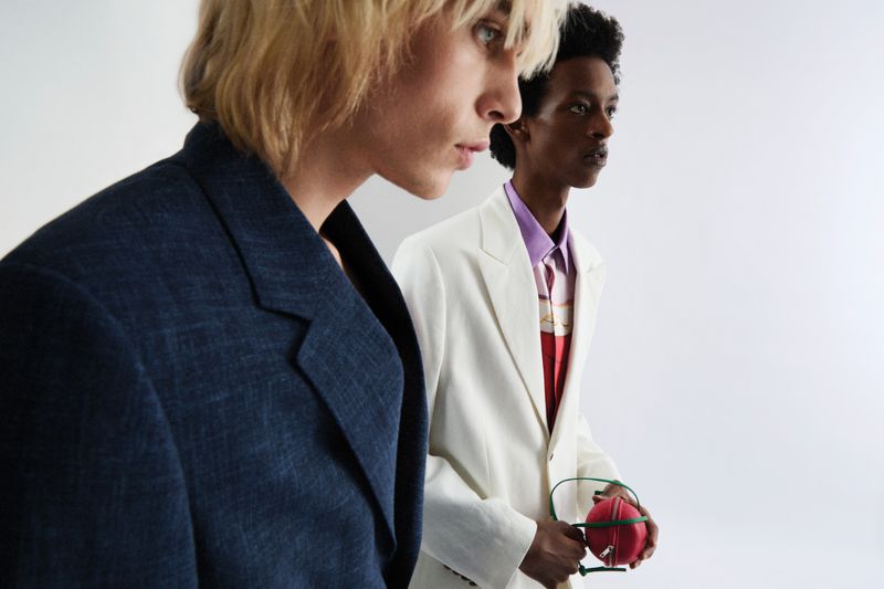Two male models in tailored blazers against a plain white background for Schon Magazine editorial A l’heure d’été.
