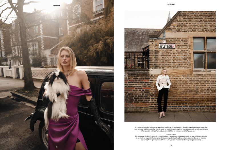 Editorial double-page spread featuring a woman in a purple dress holding a dog next to a vintage car and standing by a brick wall.