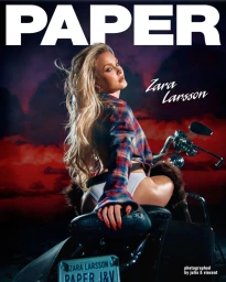 Zara Larsson posing on a motorcycle against a dramatic sunset sky for Paper Magazine cover
