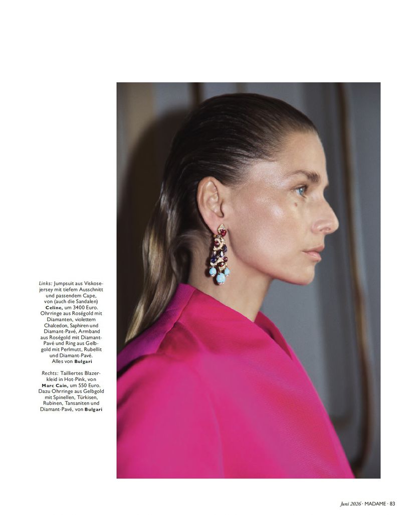 Model wearing a vibrant hot pink jacket and elaborate gemstone earrings in a profile portrait for Madame Germany editorial