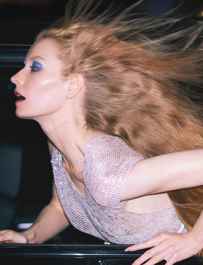 Model with long blonde hair blowing in the wind wearing a textured top for Numero Istanbul