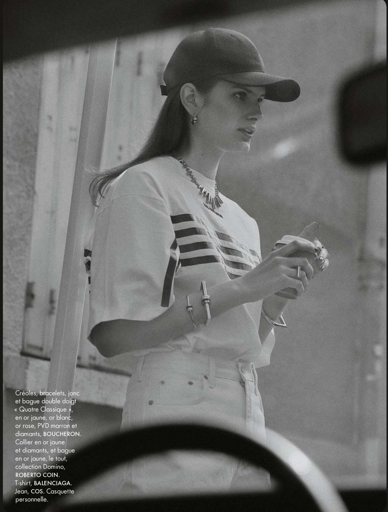 Monochrome editorial portrait of model Signe Veiteberg wearing a cap and t-shirt, framed through a car window for Elle France.