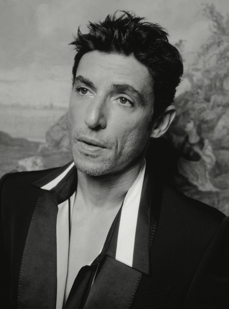 Portrait of actor Alberto Guerra wearing a black jacket with a white shirt collar for El Pais Icon Magazine