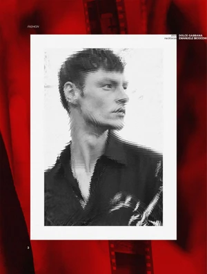 Monochrome portrait of a male model in a dark shirt with digital glitch artifacts against a stark white backdrop