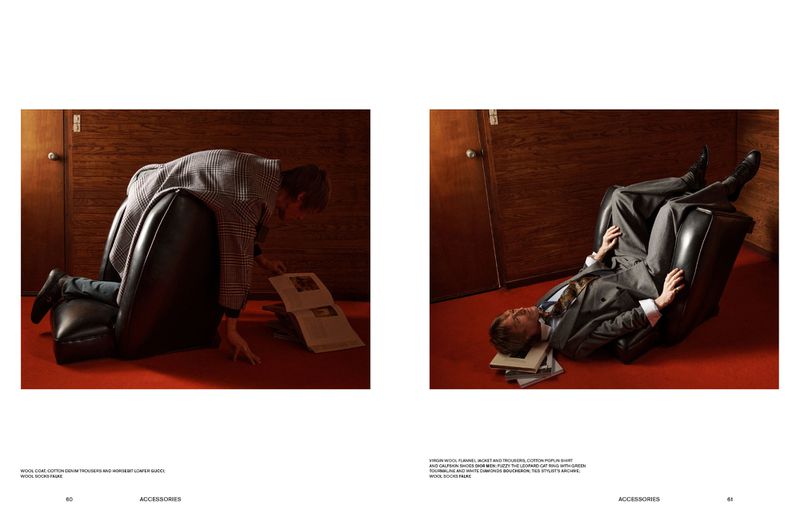 Two-panel fashion editorial spread showing a man in a grey suit interacting with a black armchair on a red carpet floor.
