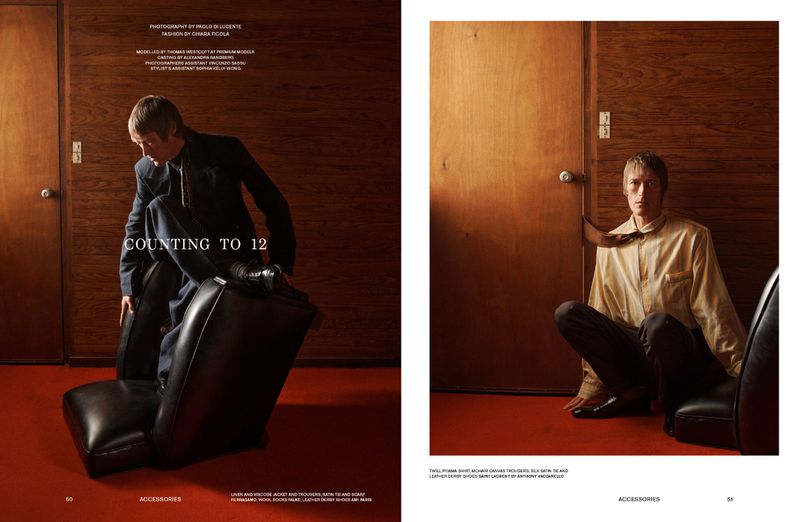 Two panel magazine spread titled Counting To 12 featuring a man in a dark suit posing with modern black leather furniture against wood paneling