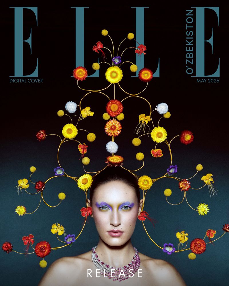 Elle magazine cover featuring a model adorned with an elaborate floral headpiece and statement jewelry, set against a dark background.