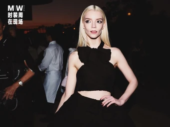Anya Taylor-Joy wearing a black halter top and skirt at an evening event captured by Tianzheng Yun for Modern Weekly China.