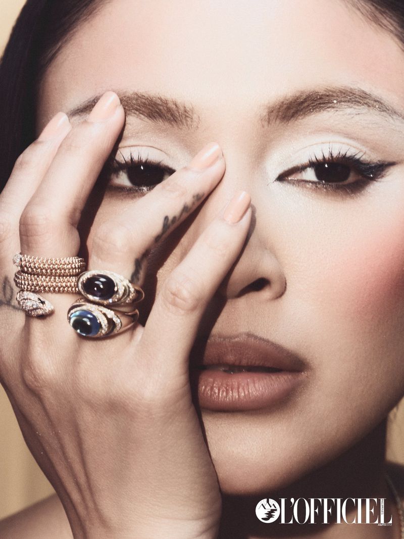 Close-up portrait of Nadine Lustre wearing statement rings and holding her hand near her face for L'Officiel Philippines.
