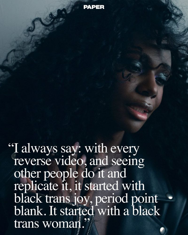 Portrait of a Black woman with dark curly hair wearing a leather jacket, featuring overlaid quote text from Paper Magazine.