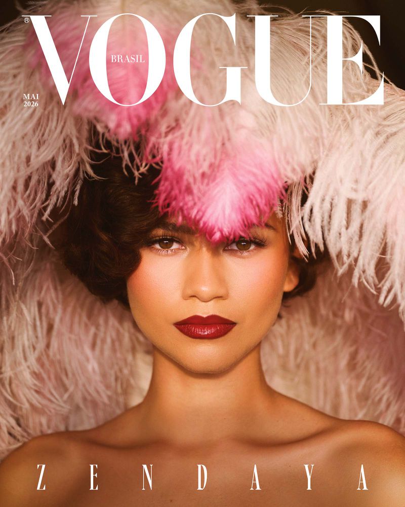 Zendaya framed by voluminous pink feathered headwear on the cover of Vogue Brasil
