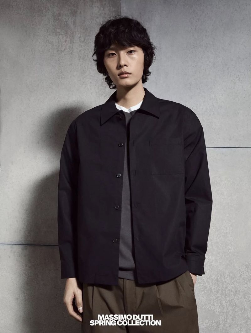 Model Dugyeong Kim wearing a black buttoned shirt for Massimo Dutti Spring Collection, photographed by Ami Lusinchi.