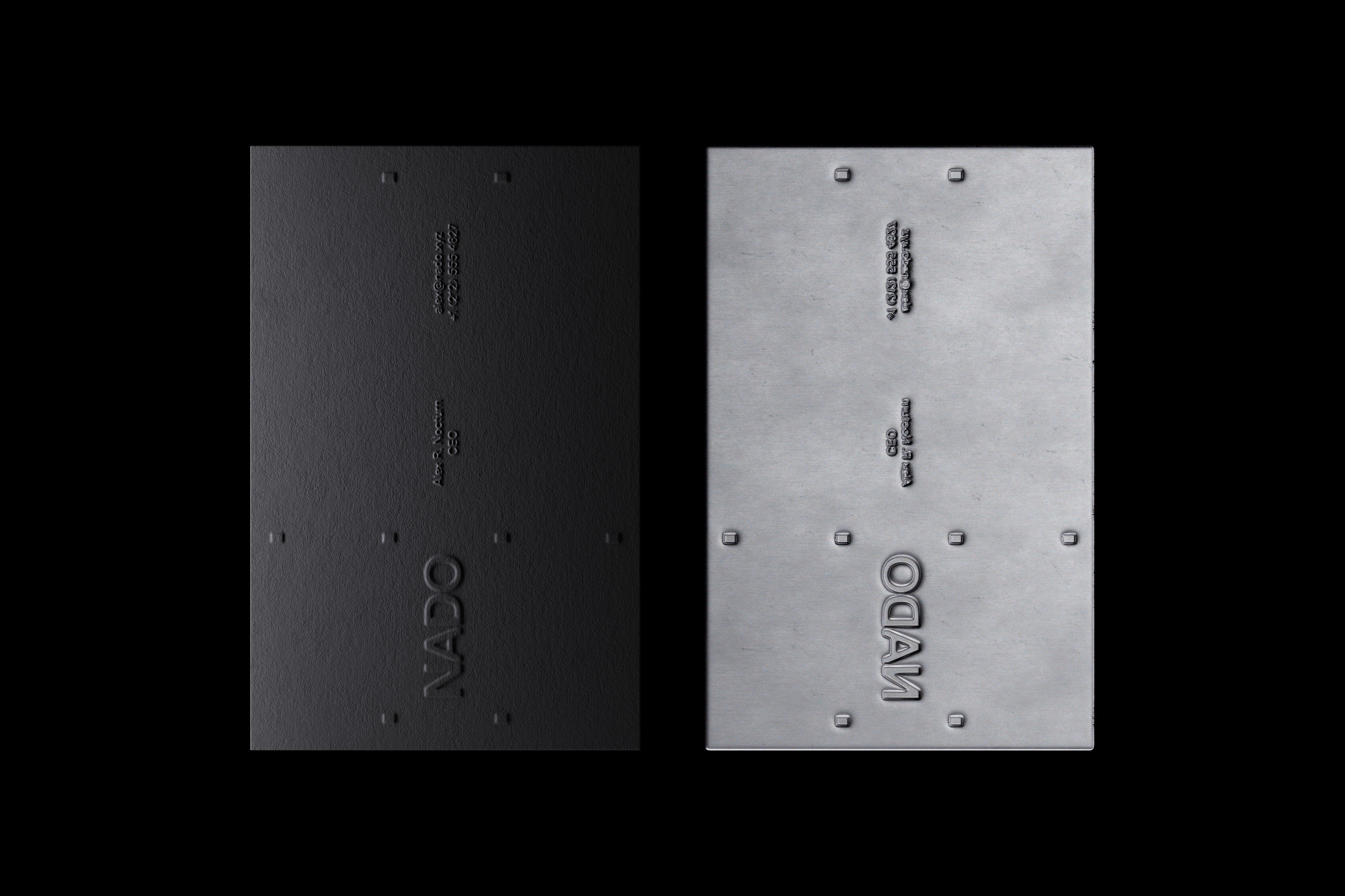 Studio shot of two metal plates, one black and one silver, each with the name 'VADO' embossed, minimal design, clean aesthetic.