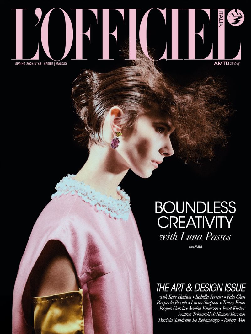Magazine cover featuring a woman with an updo wearing a pink dress against a black background, featuring the L'Officiel logo.