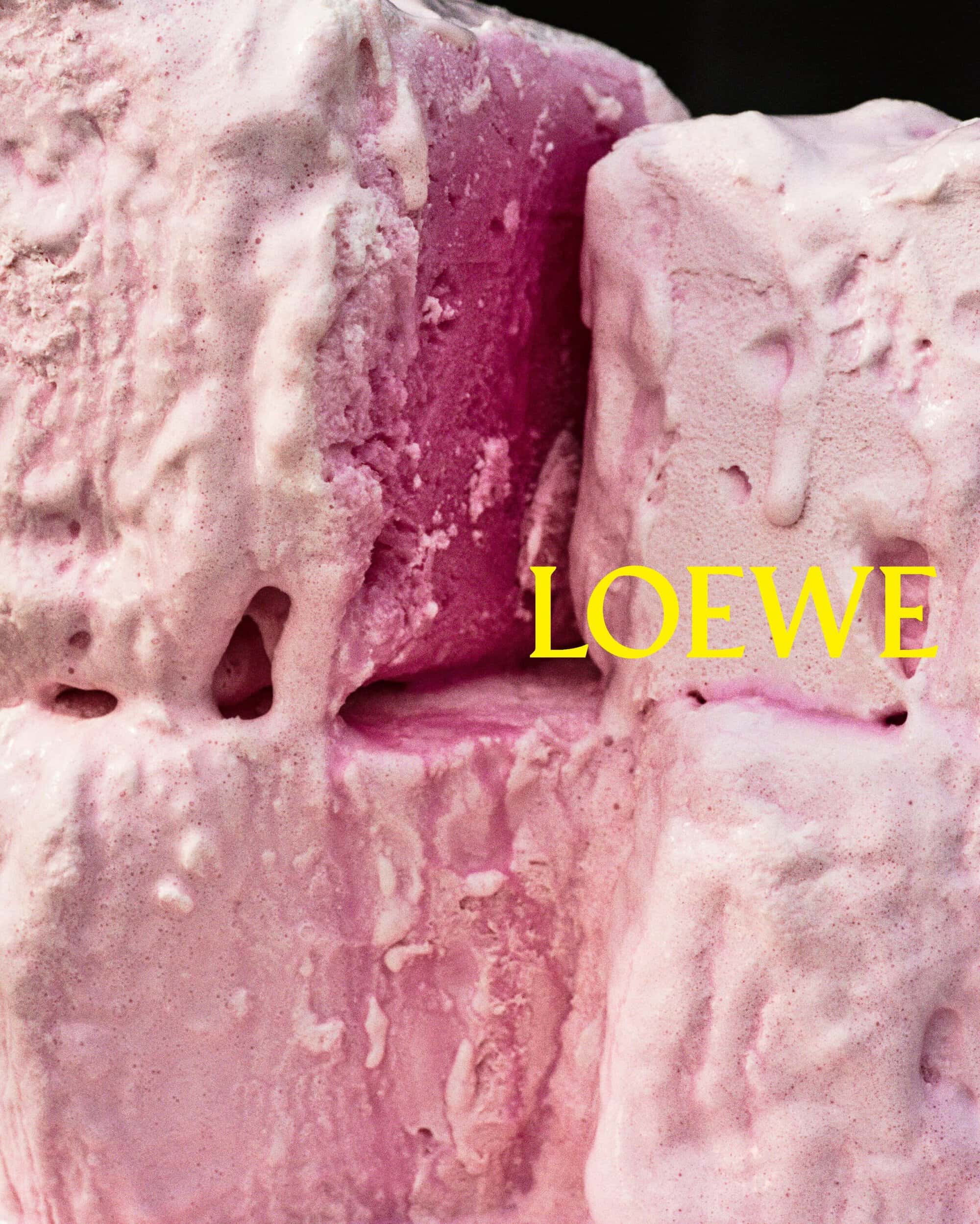 Close-up macro shot of pink textured foam blocks with bold yellow Loewe text branding