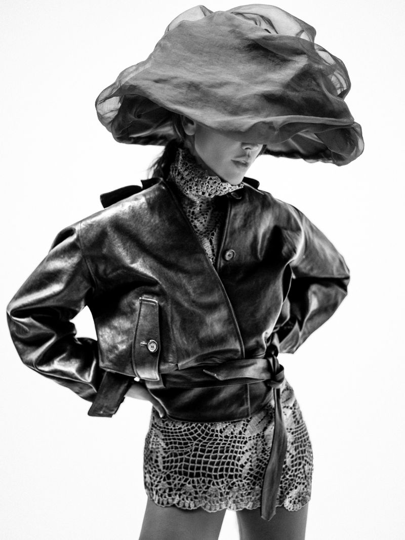 Eiza Gonzalez wearing a large sheer black hat and leather jacket for Numero Netherlands photographed by JuanKr.