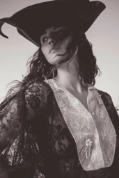 Portrait of Eiza Gonzalez wearing a black wide-brimmed hat and lace top for Numero Netherlands, photographed by JuanKr.