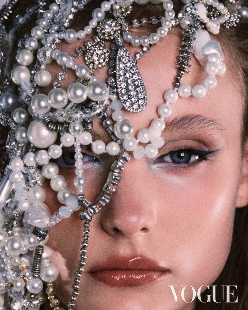 Close-up portrait of a woman adorned with cascading pearl and crystal headpieces for a Vogue Portugal editorial