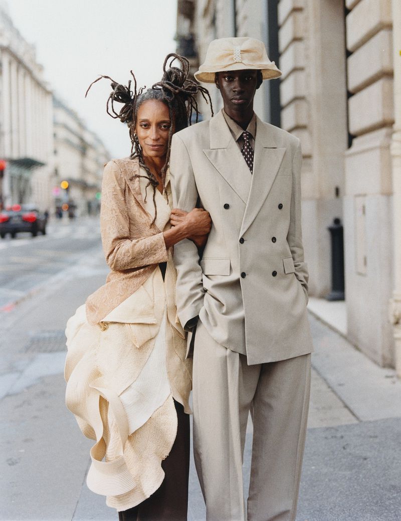 Two models standing on an urban street in tailored clothing, photographed by Alex Huanfa Cheng for Luncheon Magazine SS26.