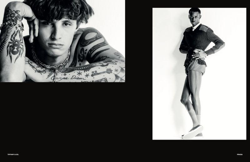 Black and white editorial fashion spread featuring two male models in a studio setting with a clean white backdrop.