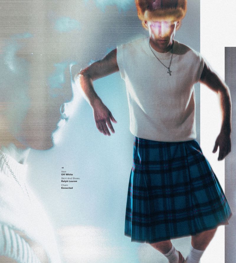 Model wearing a white knit vest and blue plaid skirt against a pale studio backdrop with double exposure light effects.