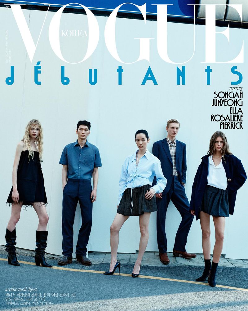 Vogue Korea cover featuring five diverse models in stylish outfits against a plain backdrop, showcasing modern fashion and youthful elegance.