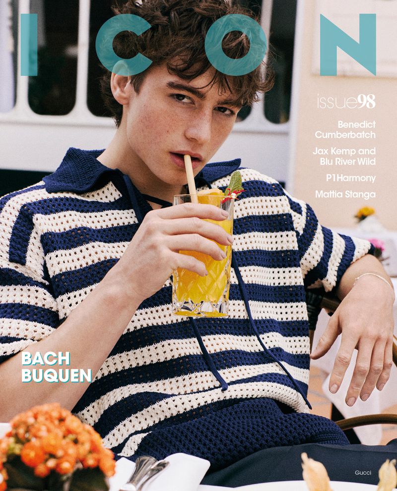Magazine cover featuring a young man drinking juice through a straw, wearing a striped top with floral table setting and text overlay.