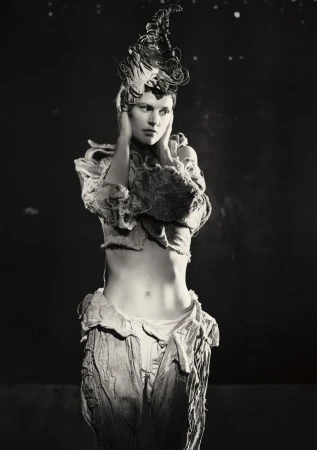 Model Saskia de Brauw with sculpted headdress and textured top for Luncheon Magazine photographed by Paolo Roversi.