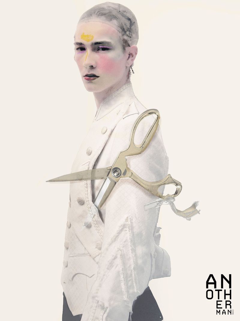 Model wearing a white jacket with a large pair of scissors overlaid, against a white seamless background for AnOther Man China.
