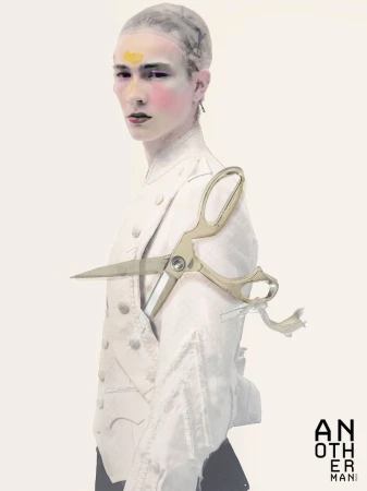 Model wearing a white jacket with a large pair of scissors overlaid, against a white seamless background for AnOther Man China.