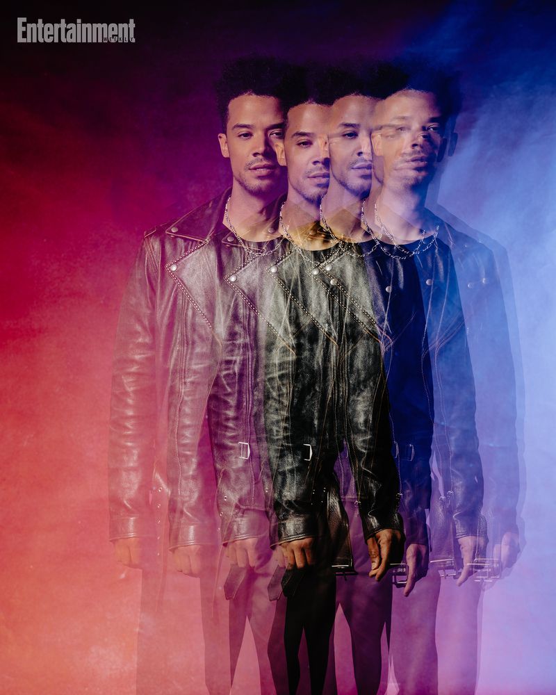 Multiple exposure portrait of a man in a black leather jacket against a red and blue lit background for Entertainment Weekly