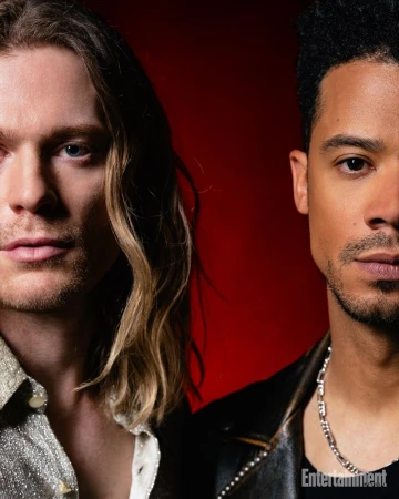 Close-up portrait of two men side by side with a red background for an Entertainment Weekly feature