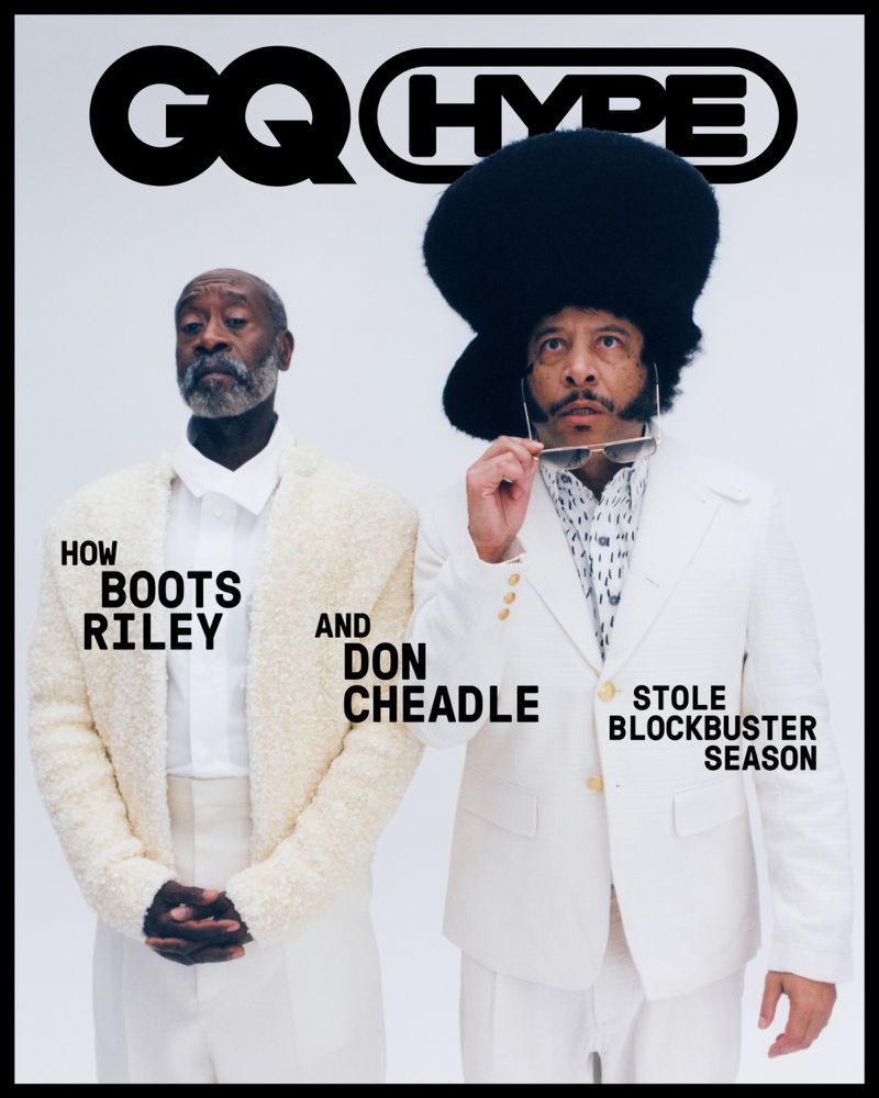 GQ Magazine cover featuring actors Boots Riley and Don Cheadle in white suits against a clean backdrop, showcasing fashion and entertainment.