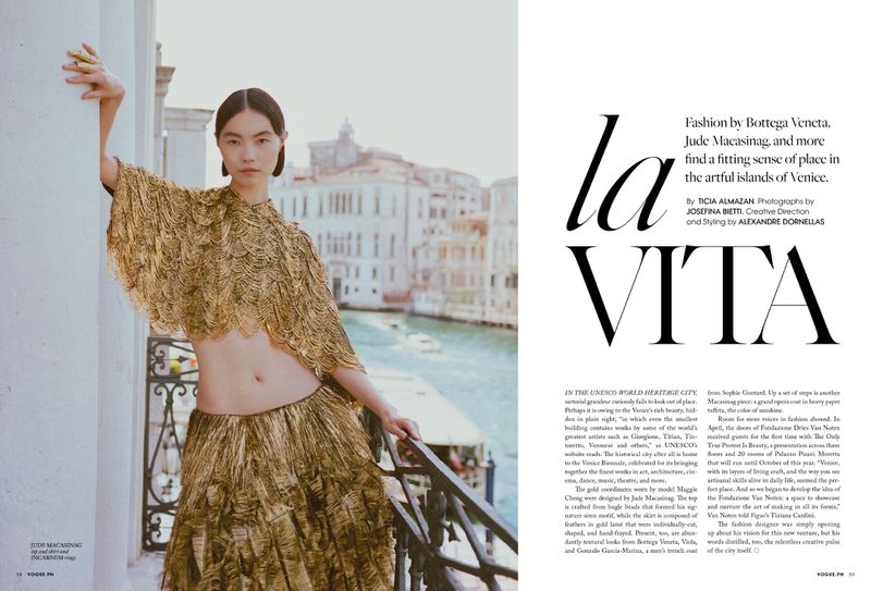 Model Maggie Cheng in a gold fringed two-piece outfit posing on a balcony overlooking a Venetian canal for Vogue Philippines.