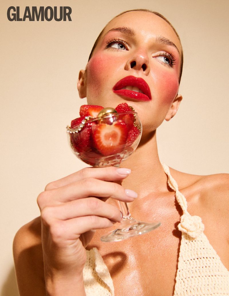 Close-up portrait of a woman holding a glass of fresh strawberries for Glamour Bulgaria Born to Vacation project