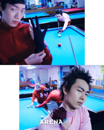 Two men playing billiards in a pool hall, one wearing a pink top and leopard-print glove posing in the foreground.
