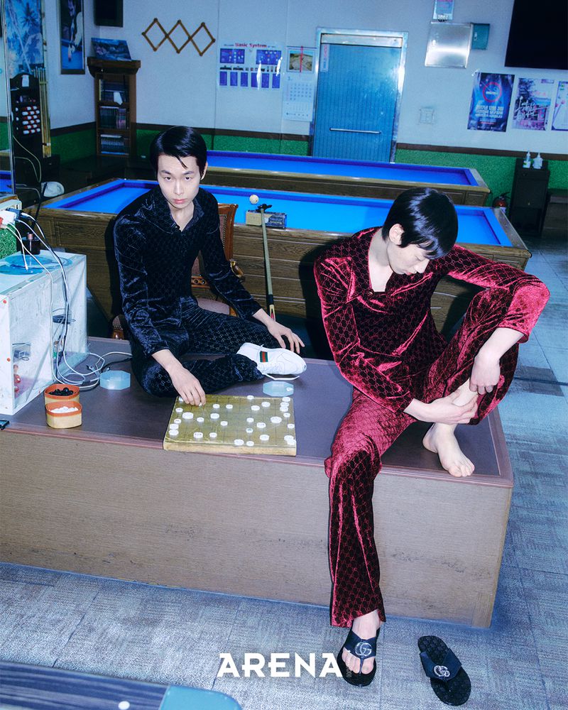 Two young men in matching velvet patterned tracksuits in a billiard hall for Arena Homme Plus Korea.