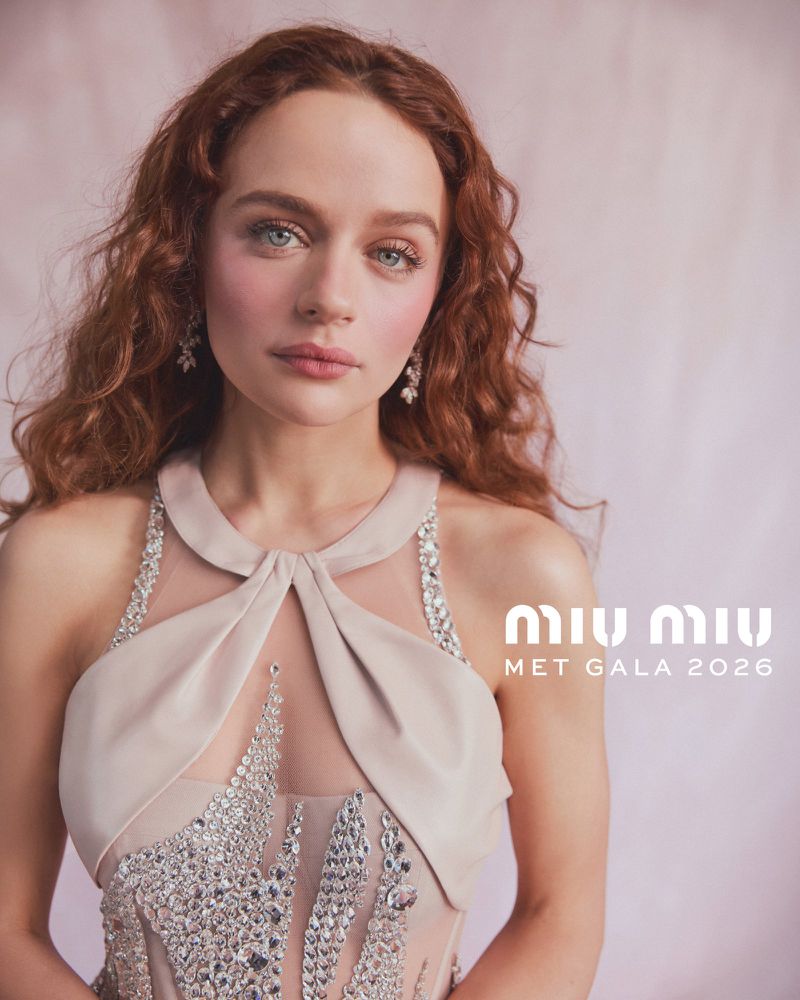 Portrait of Joey King wearing a pale halter dress with crystal embellishments for Miu Miu at the Met Gala