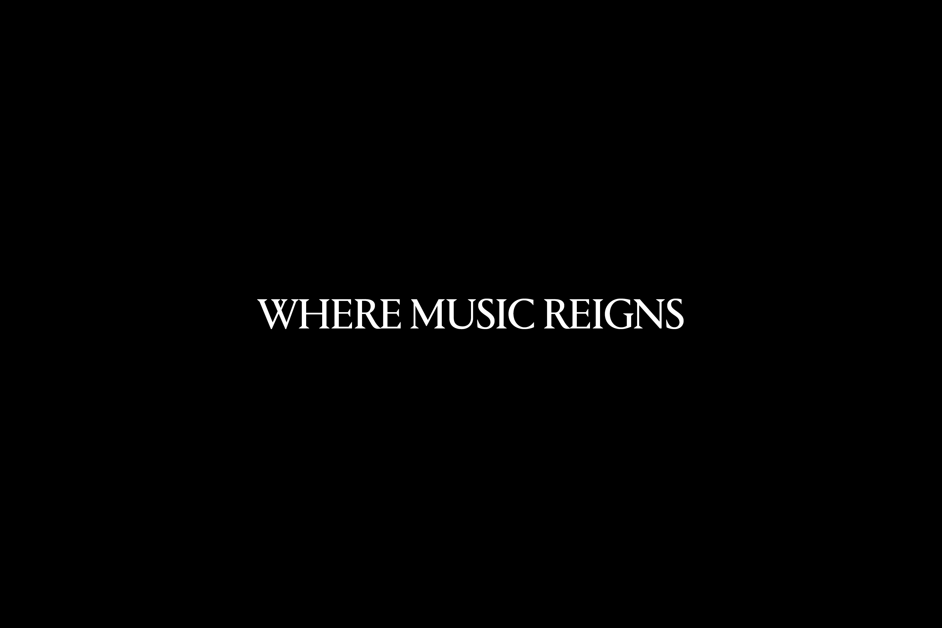 White serif typography reading WHERE MUSIC REIGNS centered against a solid black background.